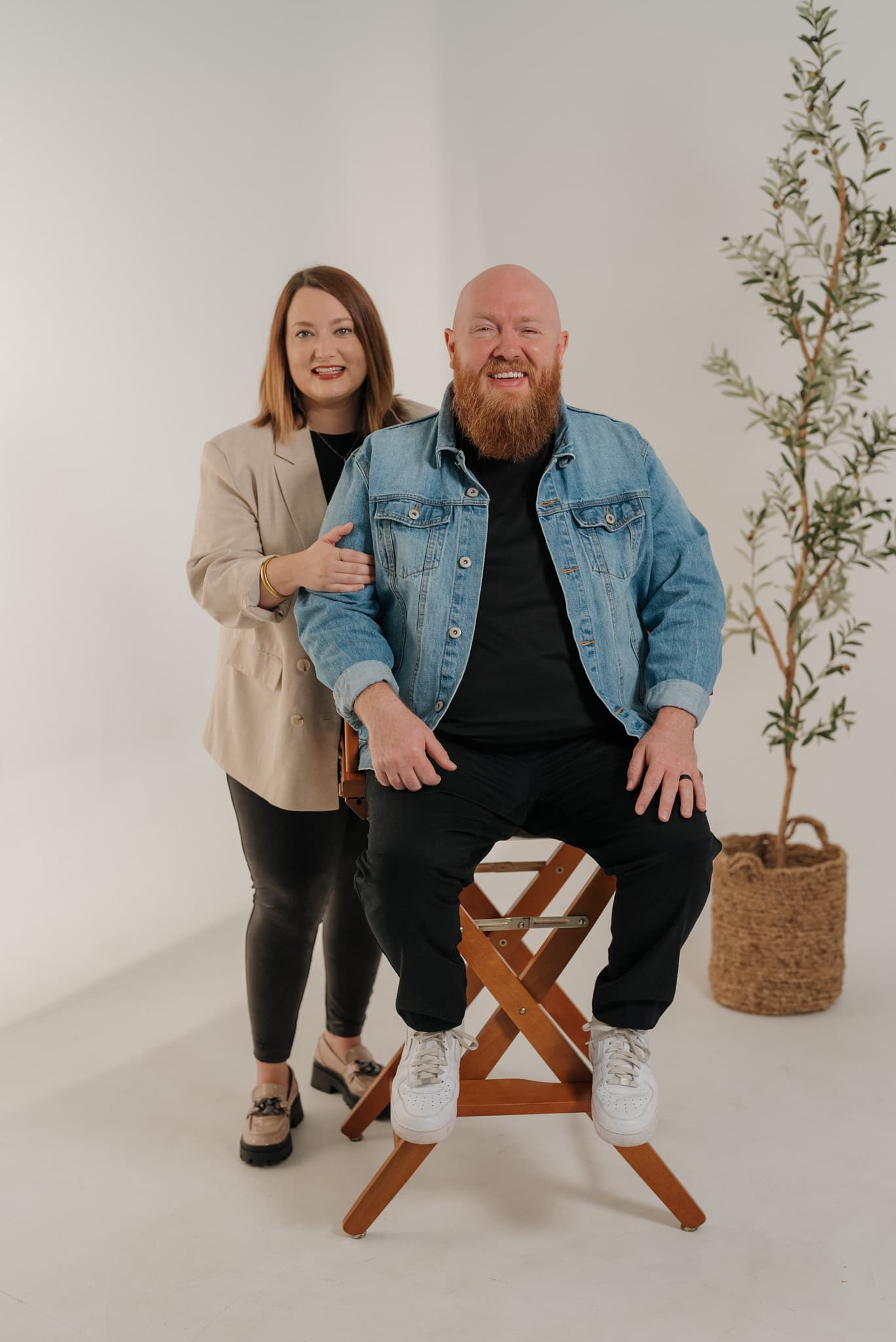 Pastors Derek and Nikki Dale standing together in a bright studio
